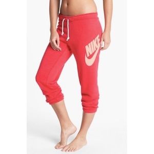 Nike Rally Cropped Capri Sweatpants in Fusion Red